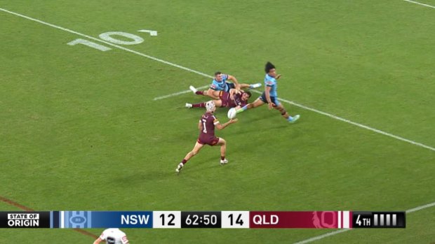 Kalyn Ponga bats the ball into the air, which Blues coach Brad Fittler says went forward. Queensland scored their final try on the next play.
