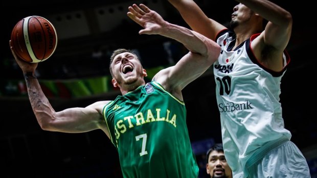 Mitch Creek lays up while playing for the Boomers.