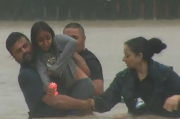 Residents flee floodwaters in West Auckland.