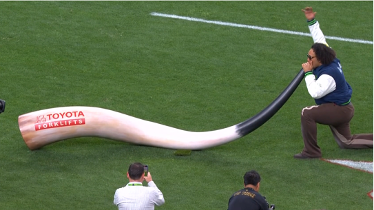 Tyler Manoa blows the Raiders horn in Las Vegas