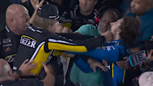 Two NASCAR drivers throw fists.