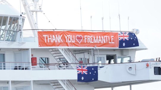 Cruise ship MS Artania which docked in Fremantle on Friday after news came to light that passengers and crew had contracted COVID-19, displayed a sign saying 'Thank you Fremantle' on Saturday.