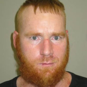 Daniel Baumgart (pictured) is wanted for questioning over the death of Michael Hartley in Gympie. 