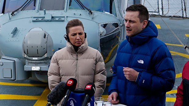 Danish Prime Minister Mette Frederiksen, with Greenland’s acting head of government Múte Bourup Egede, right, and newly elected head of government Jens-Frederik Nielsen, centre, on board the Danish Navy inspection ship Vaedderen, in Nuuk, Greenland, on Thursday.
