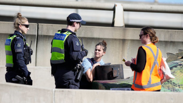 ‘Disrupt the weapons’: Woman arrested as protest against military expo blocks West Gate