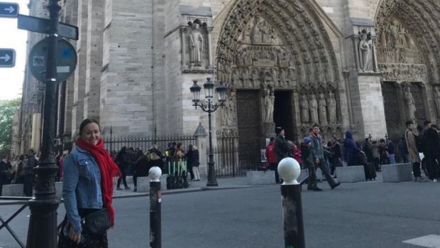 Mary Dullard out the front of the Notre-Dame in Paris just hours before fire gutted the historic cathedral.
