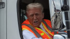 Republican presidential nominee former President Donald Trump talks to reporters as he sits in a garbage truck Wednesday, Oct. 30, 2024, in Green Bay, Wis. (AP Photo/Julia Demaree Nikhinson)