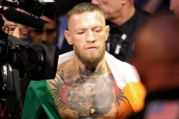 Conor McGregor of Ireland walks through the arena.
