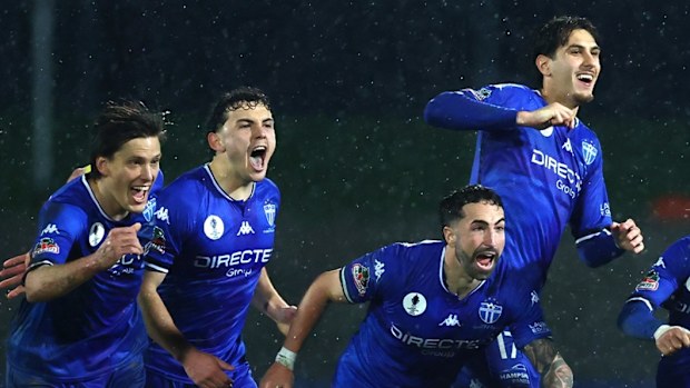 South Melbourne players celebrate a win during the Australia Cup.