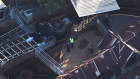 Emergency service personnel at Dreamworld after the Thunder Rapids ride disaster.
