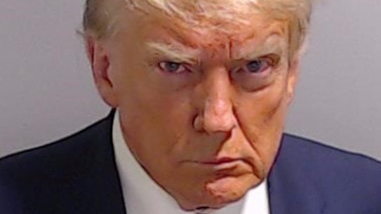 A scowling Donald Trump is booked in Georgia.