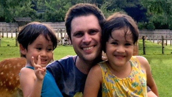 Scott McIntyre with his children in Japan.