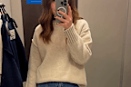The sweater comes in navy, cream, and choc plum