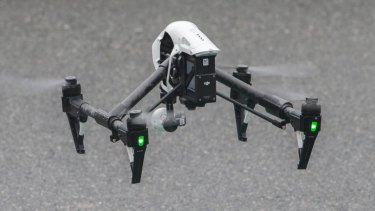 Queensland Police operate a drone at the scene of a fatal house fire at 5 Hilliup Street in Westlake on June 16, 2015 in Brisbane, Australia.  
