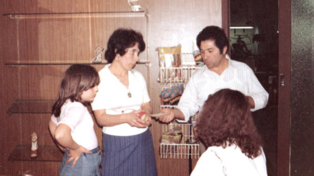 Lina, Donato and a young Guilia Angerosa with a customer in the store's heydey.