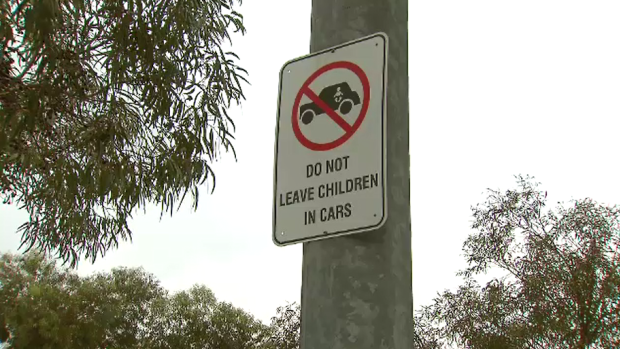 A sign in the car park near the Point Cook venue where the child was found in the car. 
