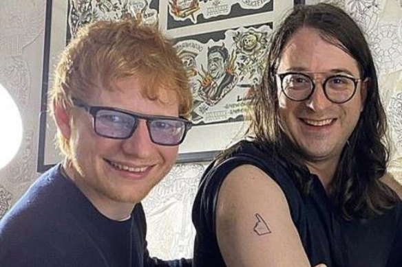 Ed Sheeran with Matt Gudinski as he gets a tattoo as a tribute to his father.