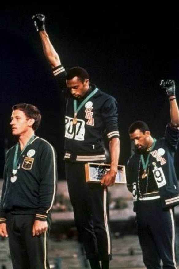 Australia's Peter Norman (left) joins American athletes Tommie Smith and John Carlos on the podium during the famous "Black Power" demonstration in 1968.