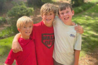 Sam Ebert, right, with twins Christian and Bridon Hassig. The three boys saved Brad Hassig, the twins’ father, who was drowning in their backyard pool. 