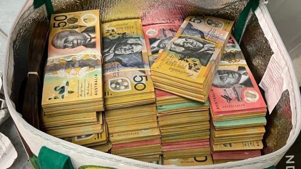 $500,000 in cash and guns seized in raids across Sydney
