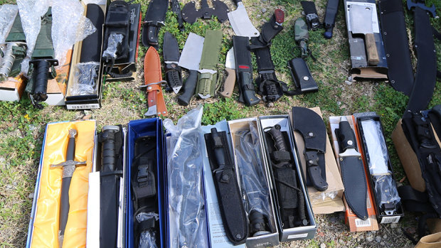 More than 100 knives and swords were found.