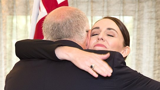 Scott Morrison and  Jacinda Ardern hug following the service for those killed in Christchurch.
AAP