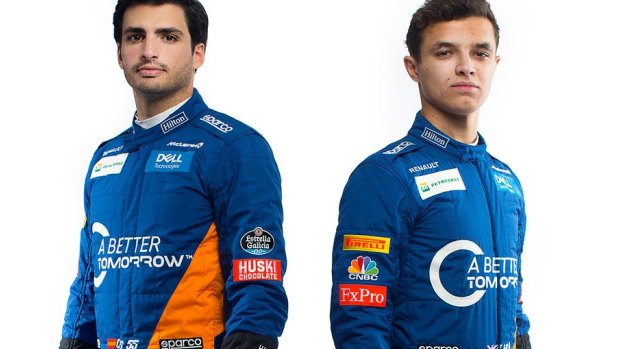 McLaren drivers Carlos Sainz and Lando Norris in racegear with the 'A Better Tomorrow' slogan