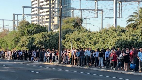 Stranded commuters waiting for a replacement bus at Caulfied station on Monday.