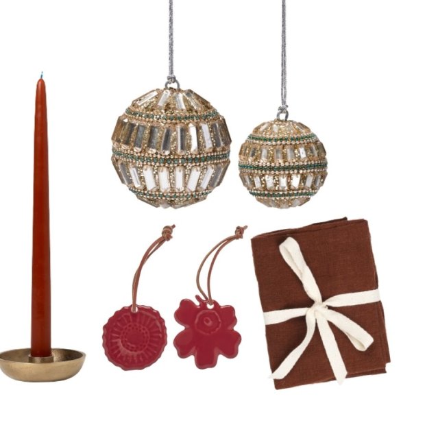 Ferm Living “Bowl” candleholder from Arrival Hall.  Adairs “Gatsby” bauble. Ferm Living “Cinnamon” linen napkins from Designstuff. Marimekko “Holiday” ornaments.