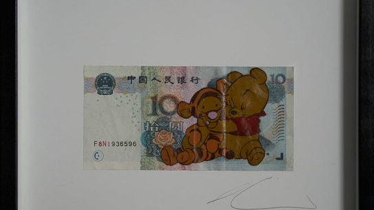 One of the works that was taken down. Winnie the Pooh, representing President Xi Jinping, strangles Tigger – a rhyme for Uighur. Winnie the Pooh is banned in China after being widely used to mock Xi.