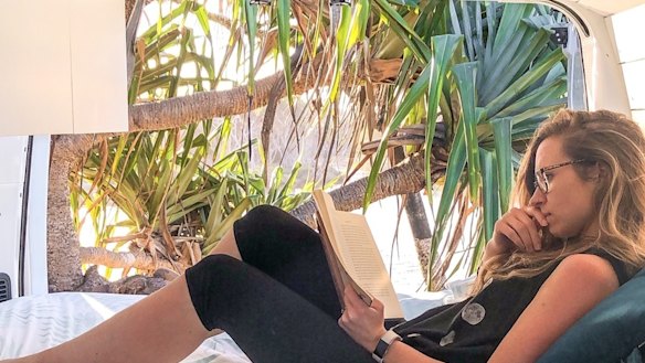 Samantha Jeffrey in the converted campervan she and her husband share on Camplify.