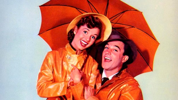 Debbie Reynolds and Gene Kelly star in the iconic film Singing in the Rain.