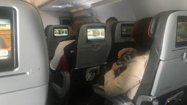 Twitter user Zette Emmons shared a photo of plane passengers transfixed by Dr Ford's testimony.
