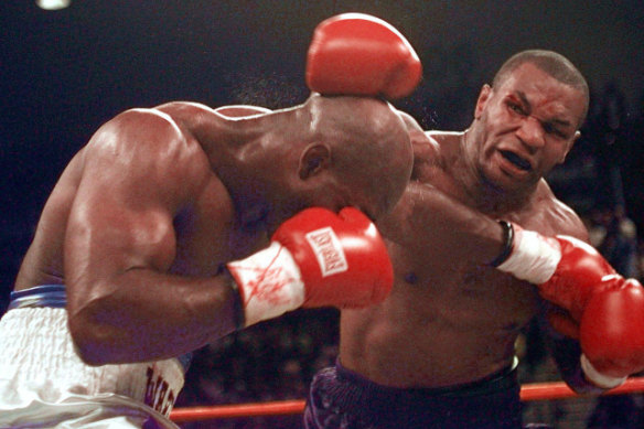 Mike Tyson and Evander Holyfield fight in 1997.