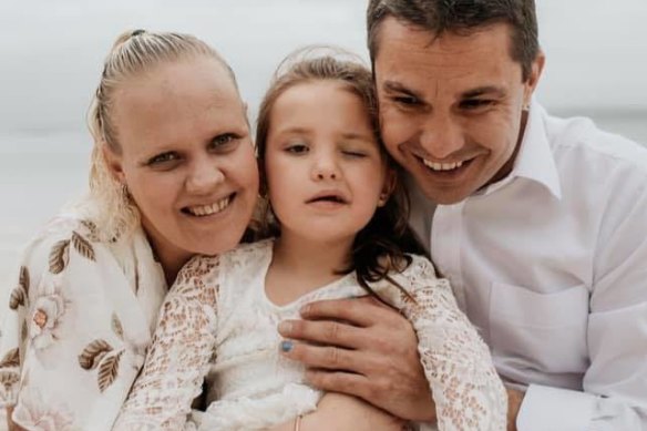 Gene and Sarah Howard with their daughter Bella.