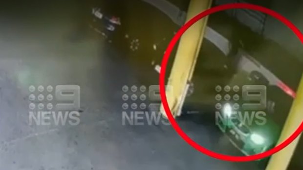 CCTV footage from the 7-Eleven shows the victim stumble away from the green Holden sedan after the shooting.