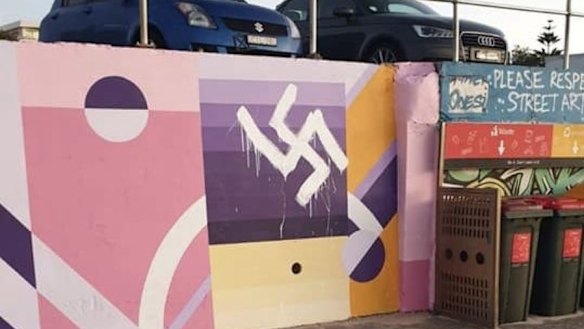 A swastika painted over a mural along Bondi's promenade early on Wednesday.