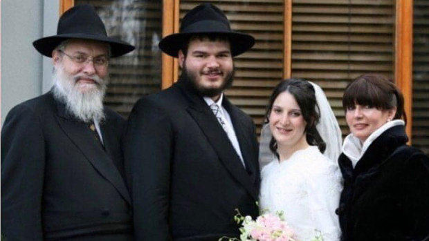 Tzvi Doniel Ben Yehudis (far left) and Itta bas Miriam (far right) are a couple from Australia who were in the Florida building collapse. 