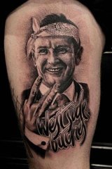A Mark McGowan leg tattoo.