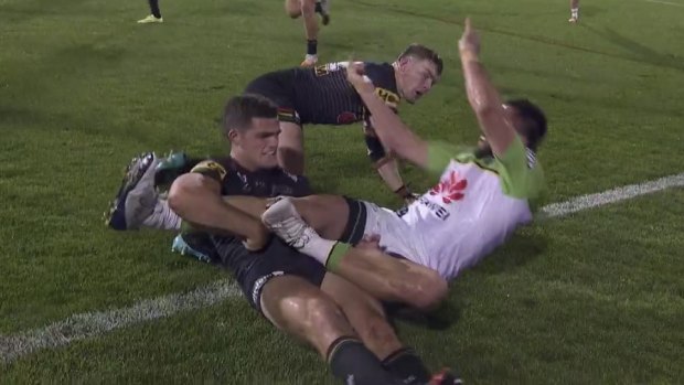 Jordan Rapana is pushed over the sideline by Liam Martin.