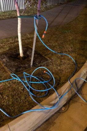The garden hose was stretched across Goonawarra Drive in Mooloolaba.