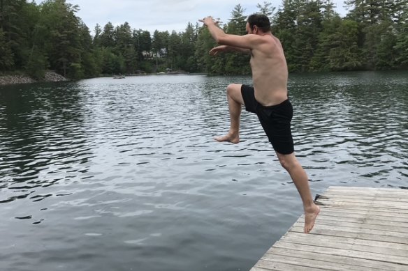 The author leaping into his happy place - in this case the remote Star Lake in the Adirondack mountains of upstate New York.