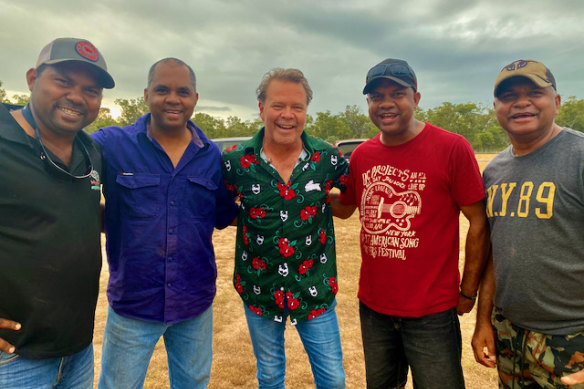 Troy Cassar-Daley (centre) with members of The Black Image Band.