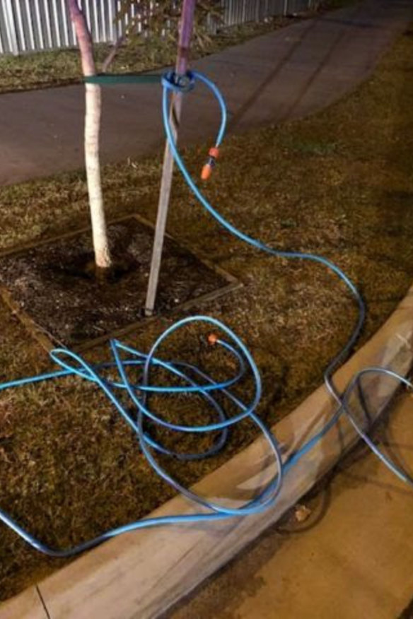 The garden hose was stretched across Goonawarra Drive in Mooloolaba.