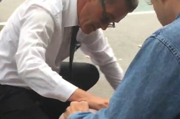 Lou Bougias tending to the injured in  Bourke Street Mall.