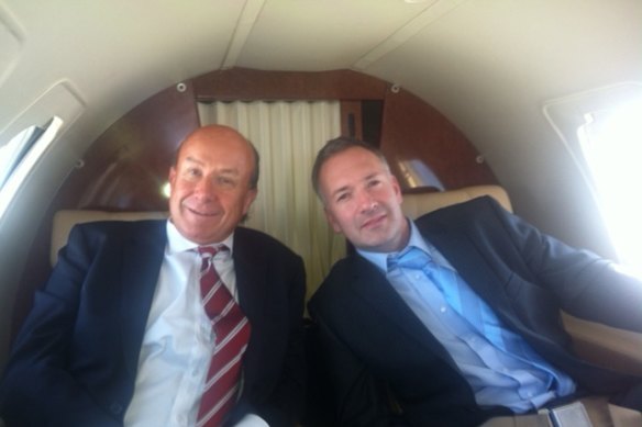 Former NewSat CEO Adrian Ballintine in a corporate jet with the then chief financial officer of his yacht company, Jason Cullen.