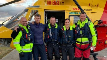 Mr Bowman pictured with rescue crews on Tuesday afternoon.