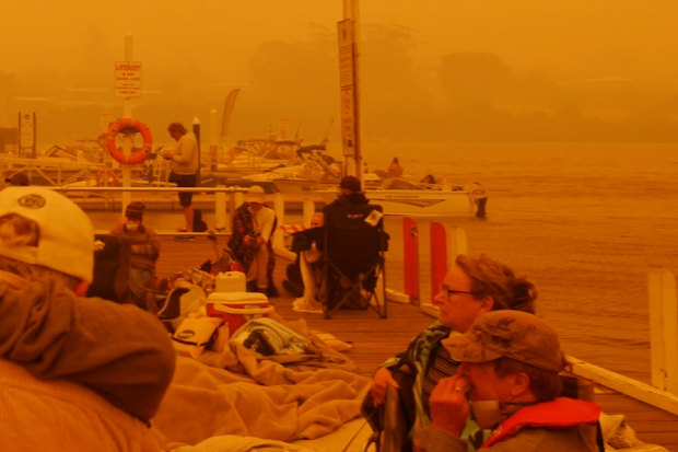 Residents and holidaymakers gathered on the pier to escape the Mallacoota inferno.