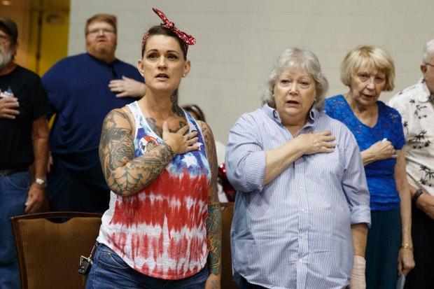 Donald Trump supporters stand for the pledge of allegiance at a Florida rally in August 2016.