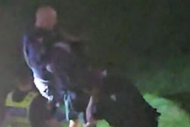 Chaos erupted at the gates of the Gold Coast 500 on Friday night after an alleged out-of-control driver ploughed into two pedestrians.